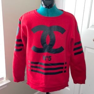 Small Red and black Coco sweatshirt with zippers on the side.